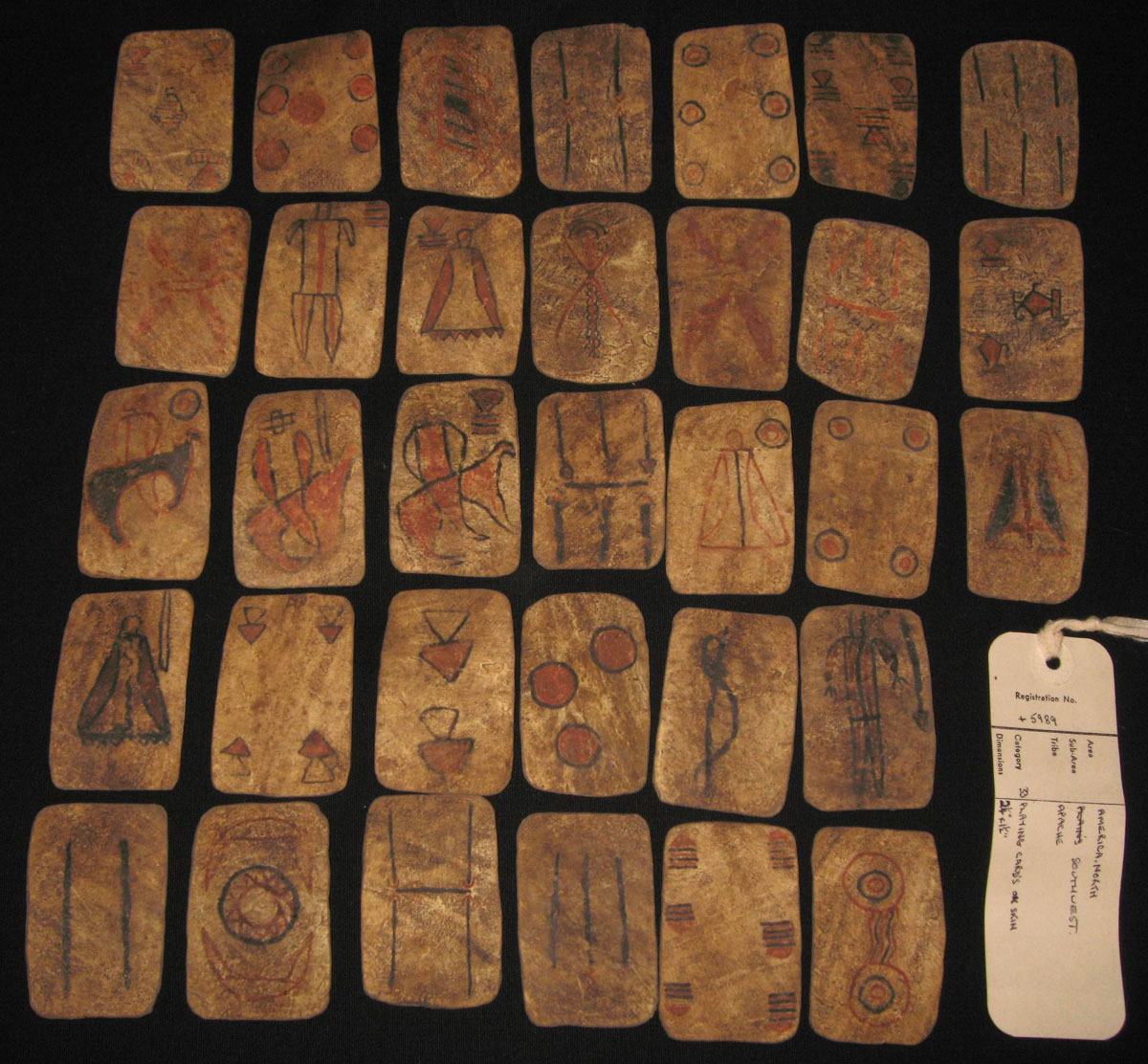 pack of 33 Apache playing-cards made of skin (deer). © The Trustees of the British Museum